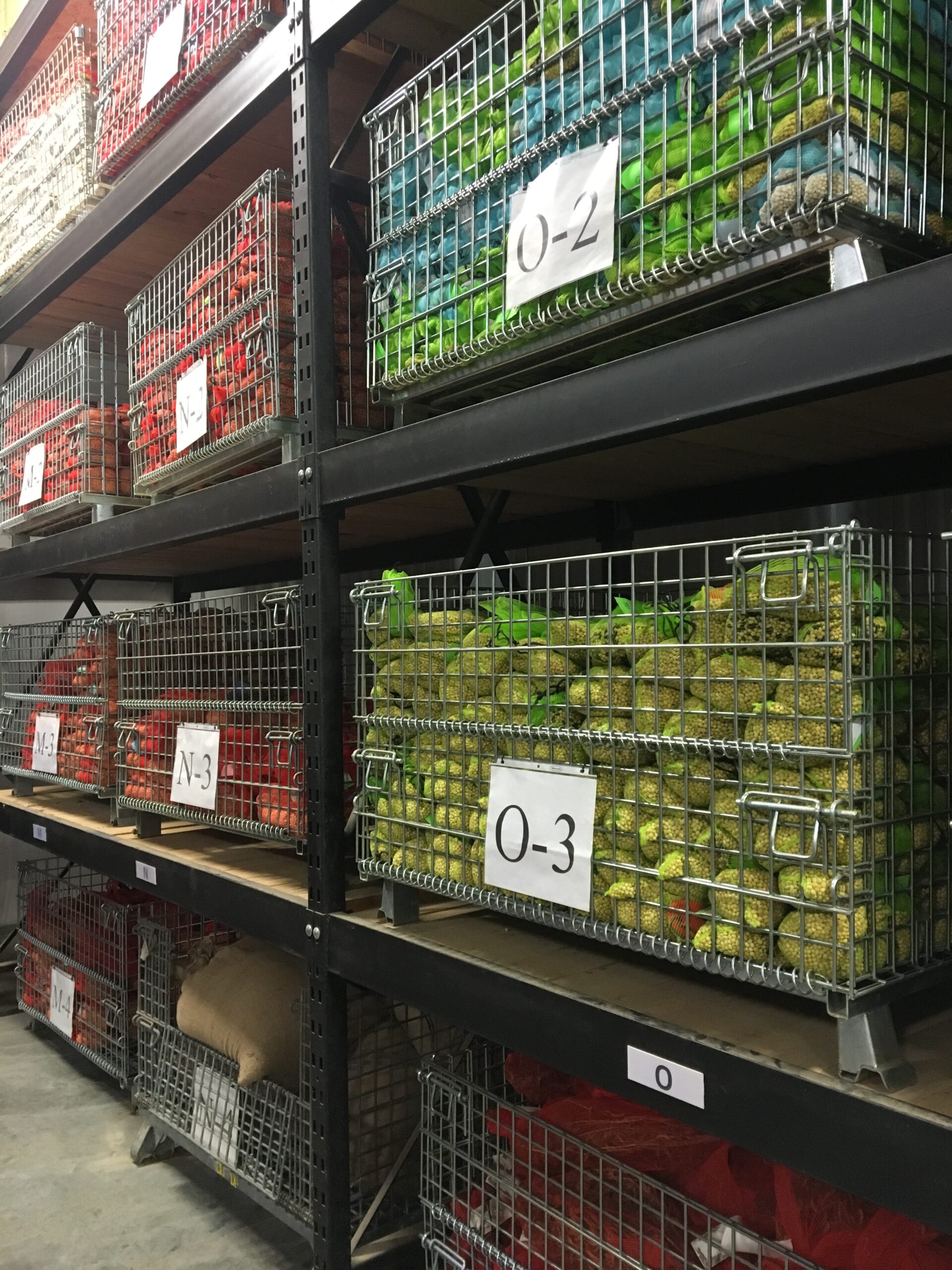 Labeled containers stacked on shelves