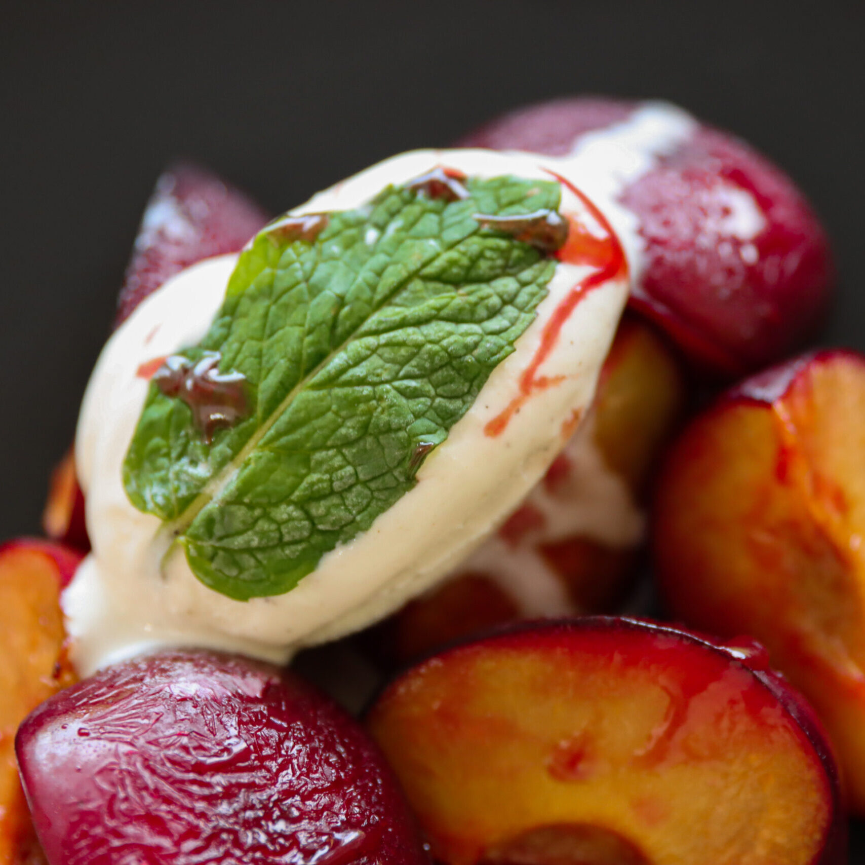 Miso Honey Roasted Plums topped with vanilla ice cream and mint