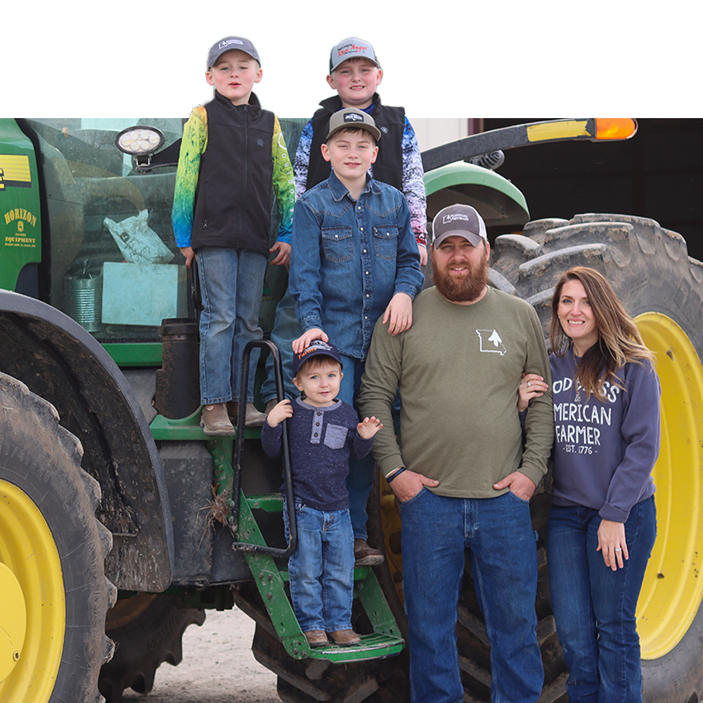 Farmer, Marc Zell with family on john deere tractor