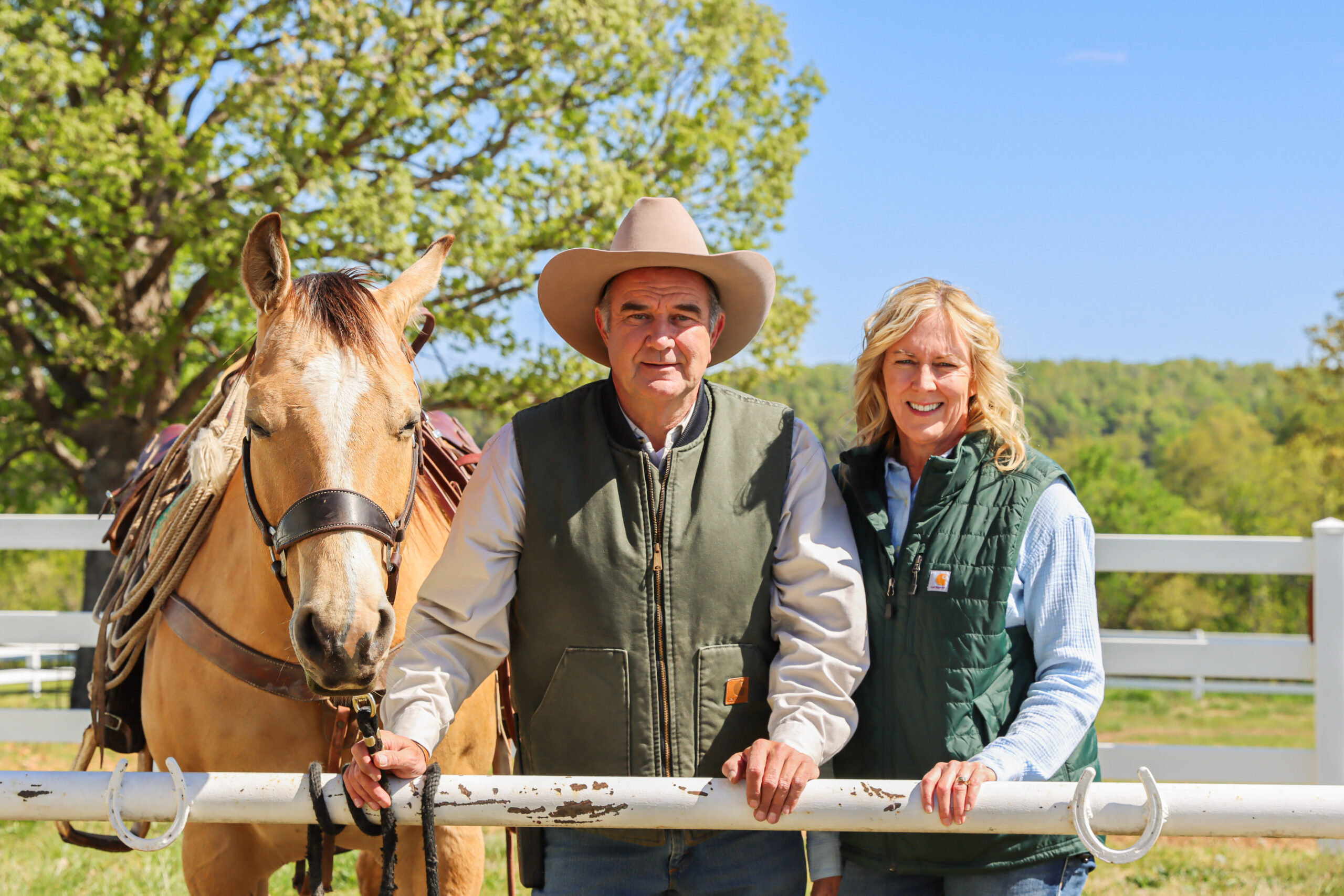 Mike Kehoe, 2024 Governor Candidate, and his wife, Claudia, pose with their horse.